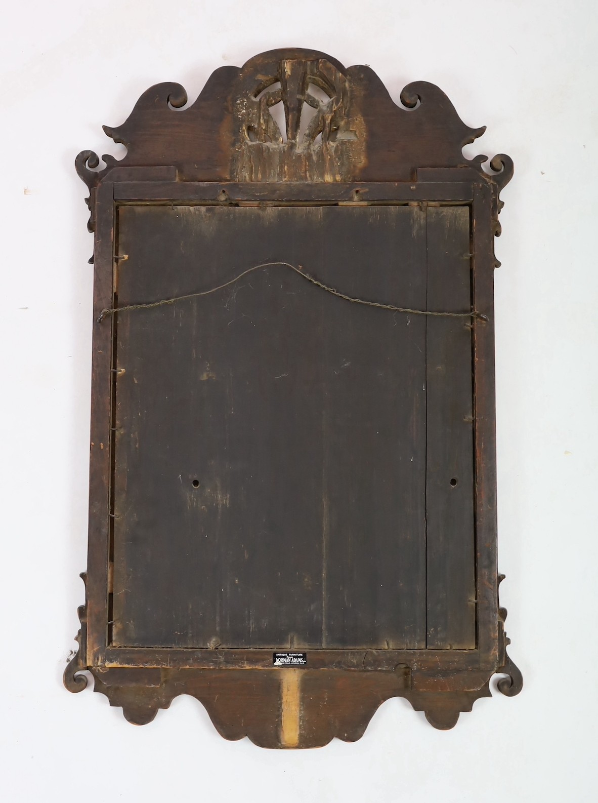 A George II walnut and parcel gilt fret frame wall mirror